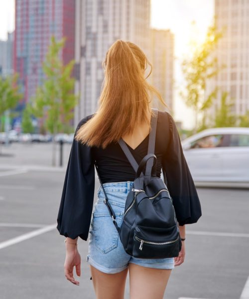 back-view-of-walking-fashionable-teenage-girl-with-2021-12-20-19-57-24-utc-min